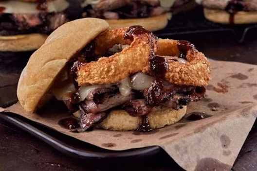 Joe's Kansas City Bar-B-Que signature dishes The Z-Man, Pork Z-Man, Chicken Z-Man.
